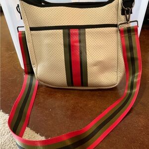 HAUTE SHORE Beige Crossbody Bag with Red and Black Stripes